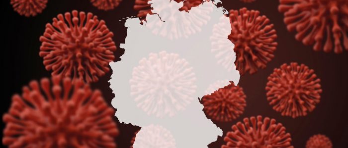 Deutschlandkarte, die von Corona-Viren umgeben ist