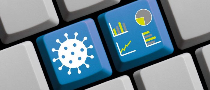 Computertasten mit Coronasymbol und stilisierten Grafiken